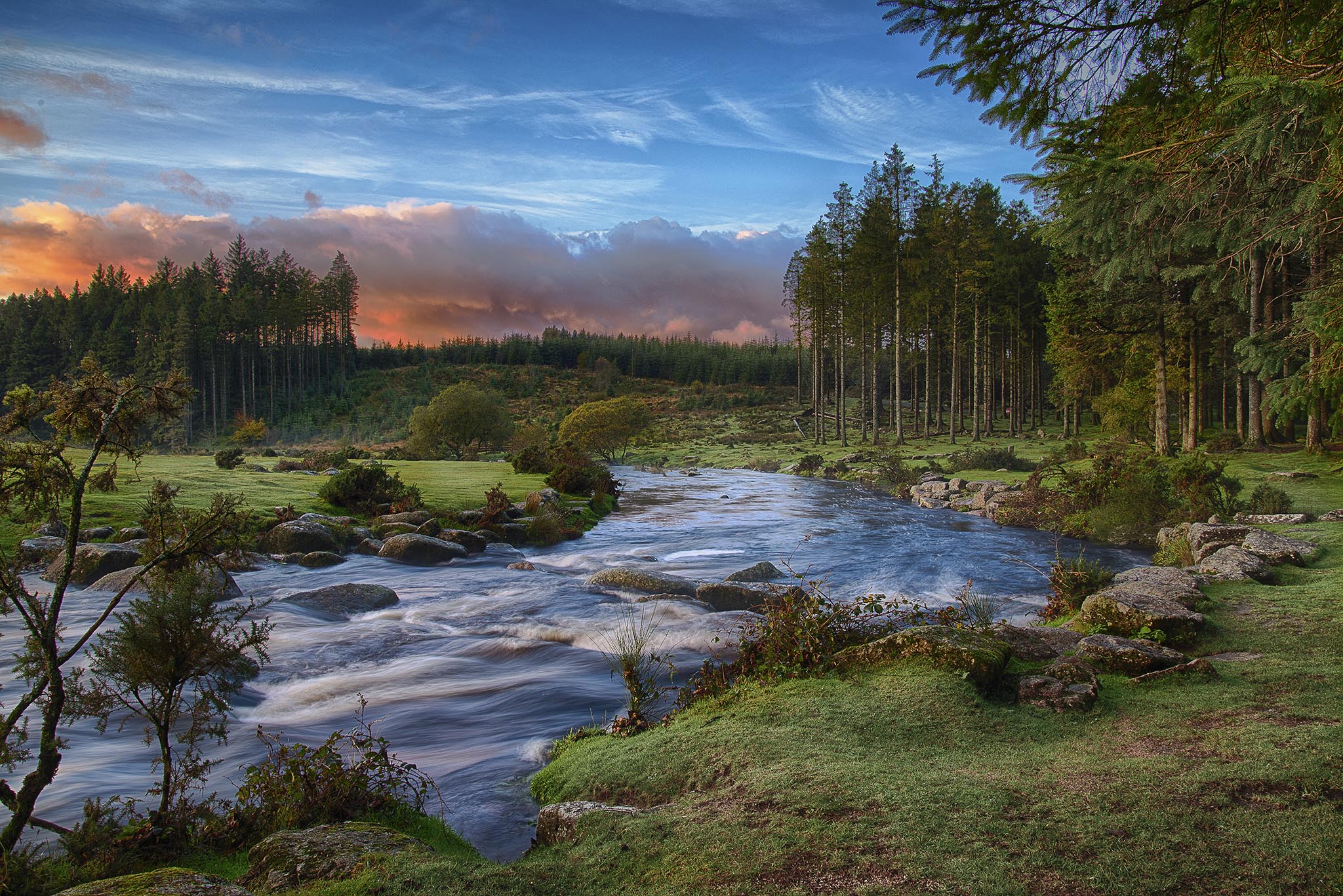 Scenic photo of a river flowing over rocks through Bellever Forest