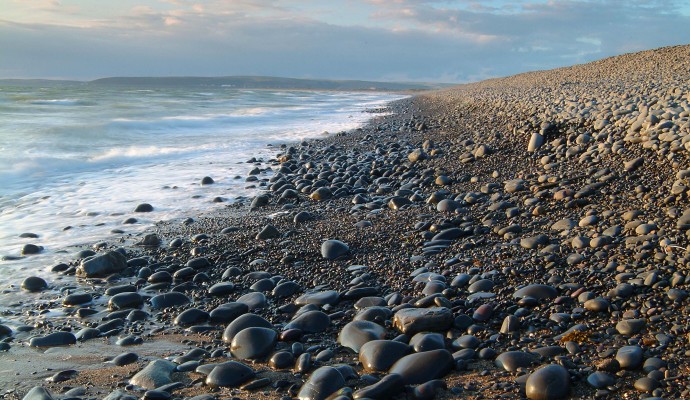 Photo of the shoreline on a pebble beach