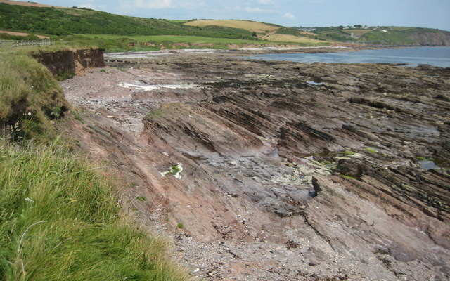 View across a rocky shore to Wembury beach