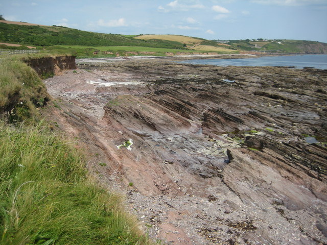 View across a rocky shore to Wembury beach