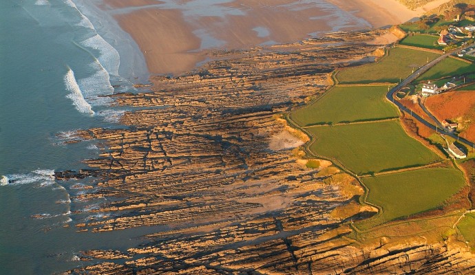 Aerial photo looking down on the beach and rocky shore at Downend and Croyde