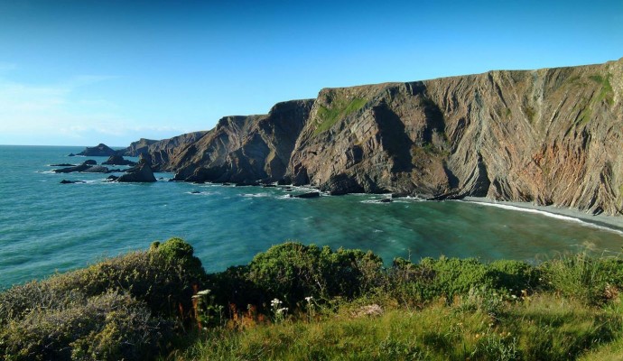 Photo of the Hartland Peninsula showing coastal cliffs and sea