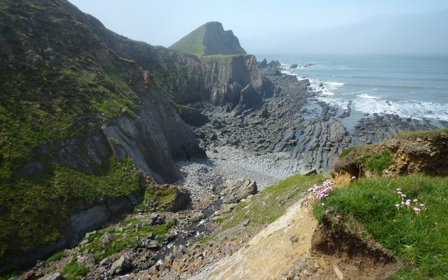 Photo of sea, rocky coast and north Devon coastal cliffs at Hartland Point