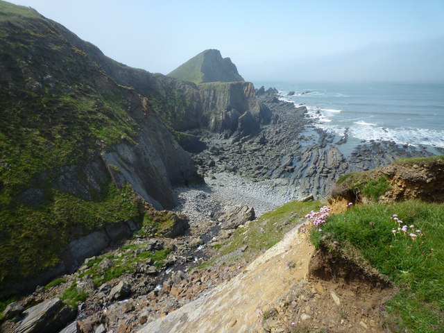 Photo of sea, rocky coast and north Devon coastal cliffs at Hartland Point