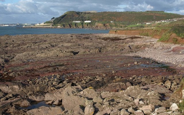 Photo of a rocky shore and the south Devon coastline at Andurn Point near Plymouth