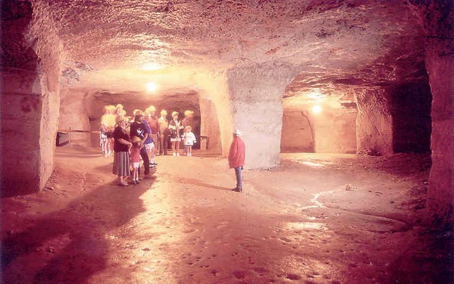 Photo of a group of people inside Beer Quarry caves