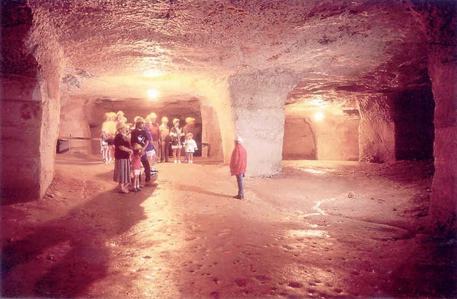 Photo of a group of people inside Beer Quarry caves