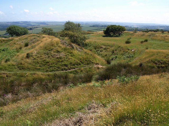 Landscape photos looking across grassy mounds of the iron age hillfort Blackdown Rings