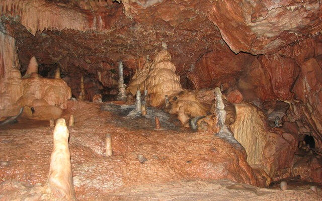 Photo inside Kents Cavern showing stalactites and stalagmites