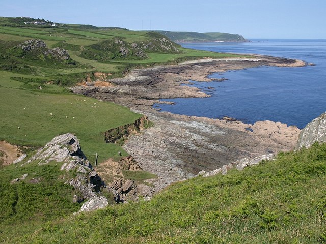 Landscape photo of Prawle Point showing coastal fields and rocky shore