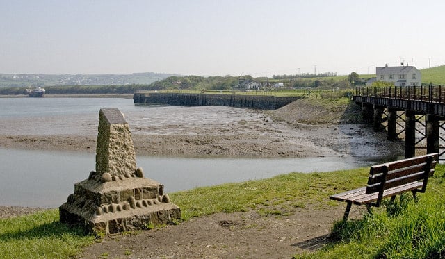 Photo of a view across the estuary and mud to Fremington Quay with a bridge on the right