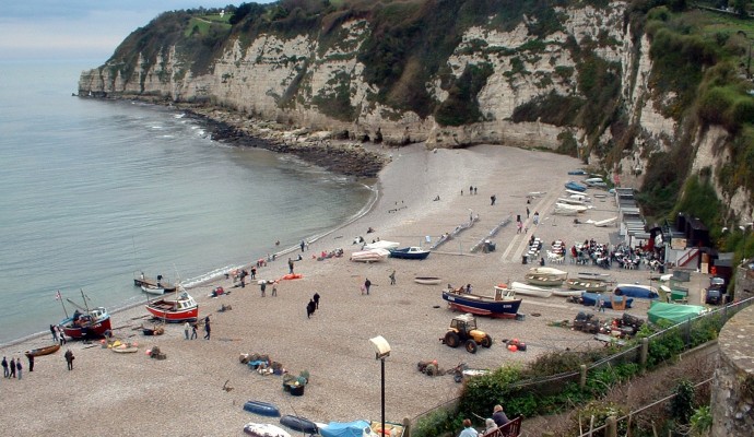 Photo looking down on the pebble beach at Beer with chalk cliffs in the background