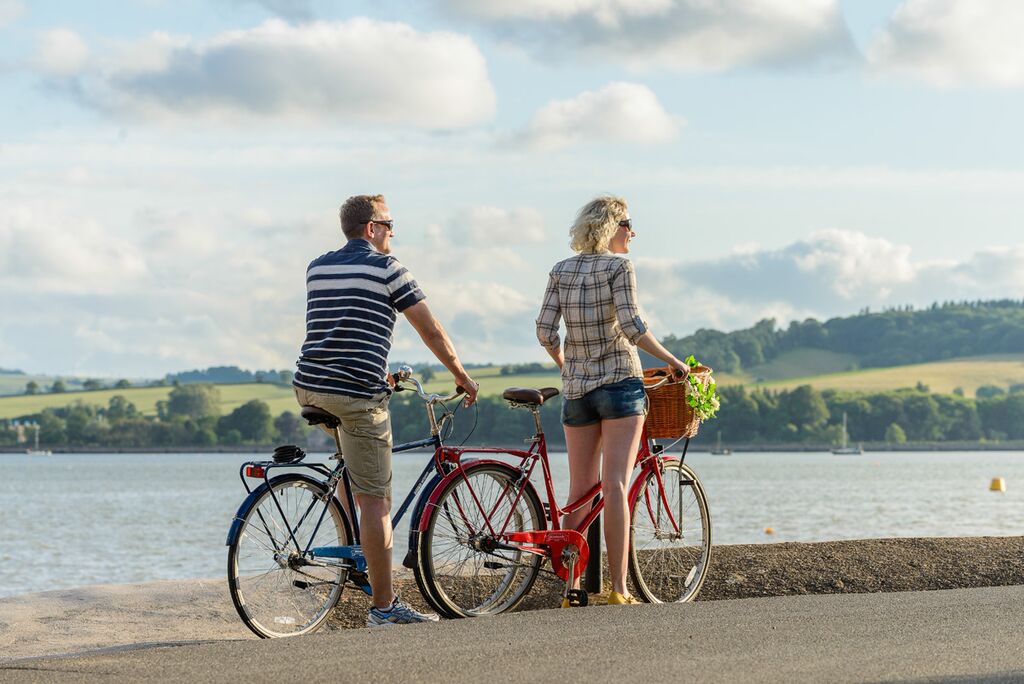 Photo of cyclists on the Tarka Trail alongside the estuary near Instow