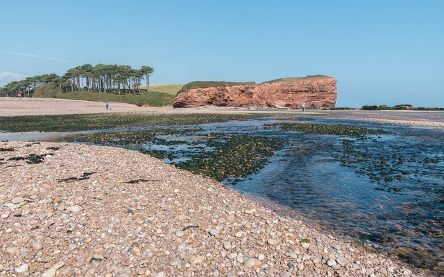 Photo of the otter estuary where it meets the pebble beach at Budleigh