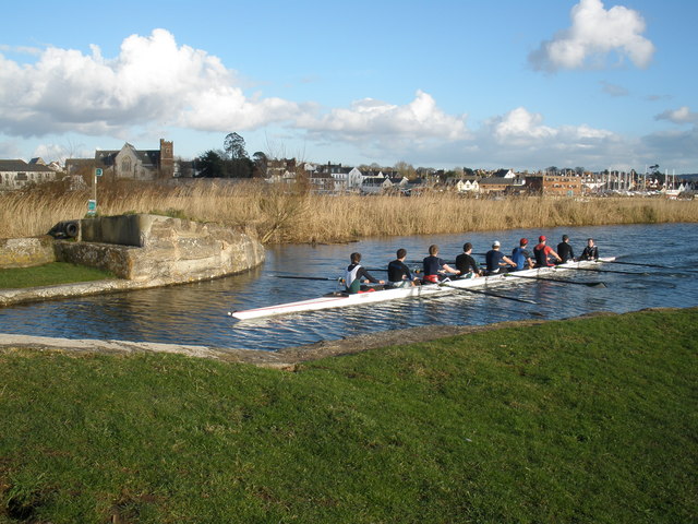 Photo of rowers on the Exeter Ship Canal with views of the city in the background