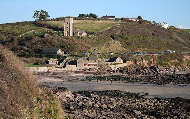 Photo across the beach at Wembury with Wembury Church in the background