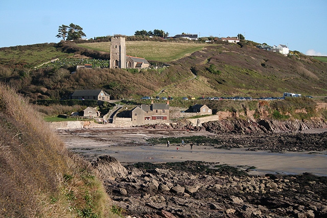 Photo across the beach at Wembury with Wembury Church in the background