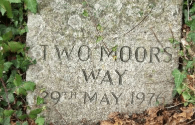 Photo of the Two Moors Way waymarking stone at Stowford Bridge